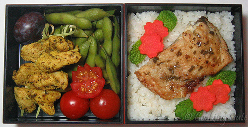 [bento with chicken skewers, edamame, tomato, rice, trout]